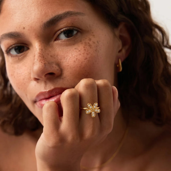 Blossom Ring worn by a model, hand at the face – sweatproof, hypoallergenic open ring