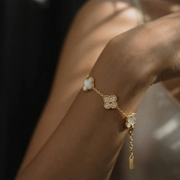 Five Clover Bracelet worn on the wrist, close-up in soft light, 18K gold PVD