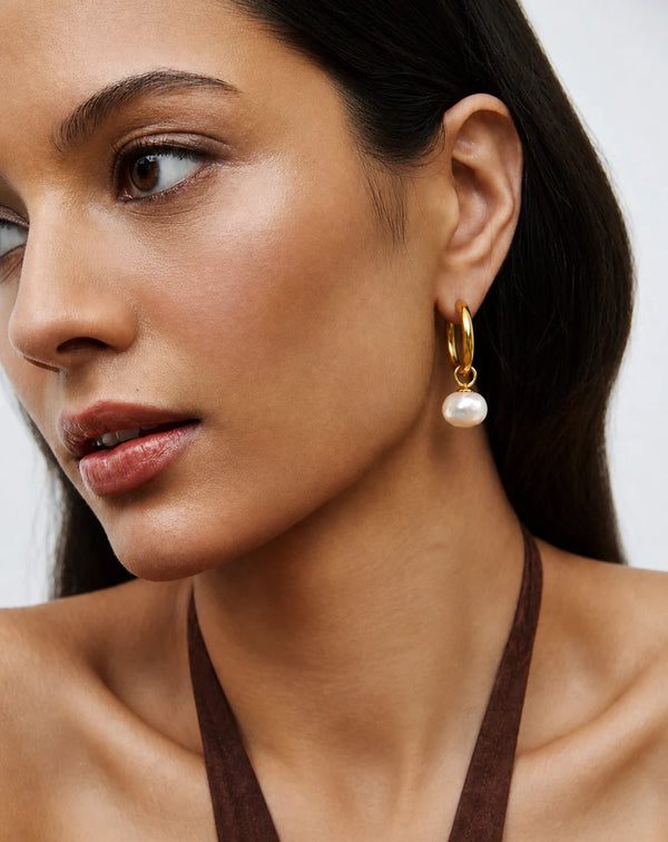 Freshwater Drop Pearl Hoop Earrings worn by a model in a black top – sweatproof, hypoallergenic pearl earrings