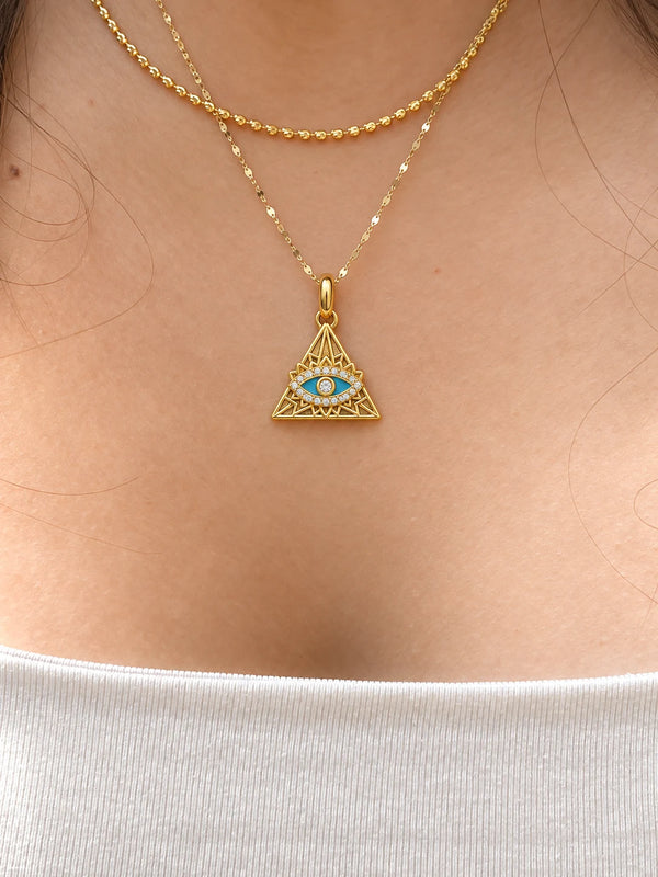 Nazar Pyramid Charm worn on a fine gold chain, close-up on the neckline – anti-tarnish charm for daily wear