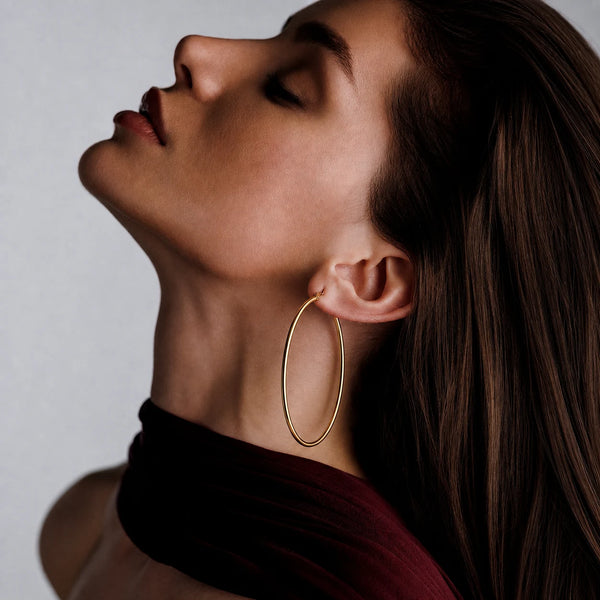 Thin Hoop Earrings worn by a model in profile – anti-tarnish hoop earrings for daily wear