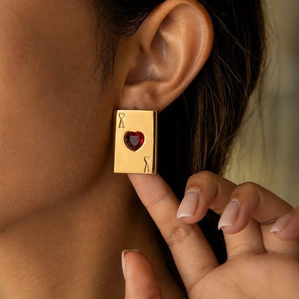 Ace of Hearts Earrings worn on the ear, fingers touching the earring – anti-tarnish stud earrings for daily wear