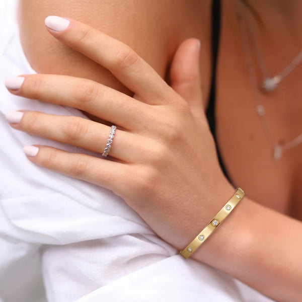 Bezel Crystal Bangle worn on the wrist against white fabric – anti-tarnish bangle for daily wear