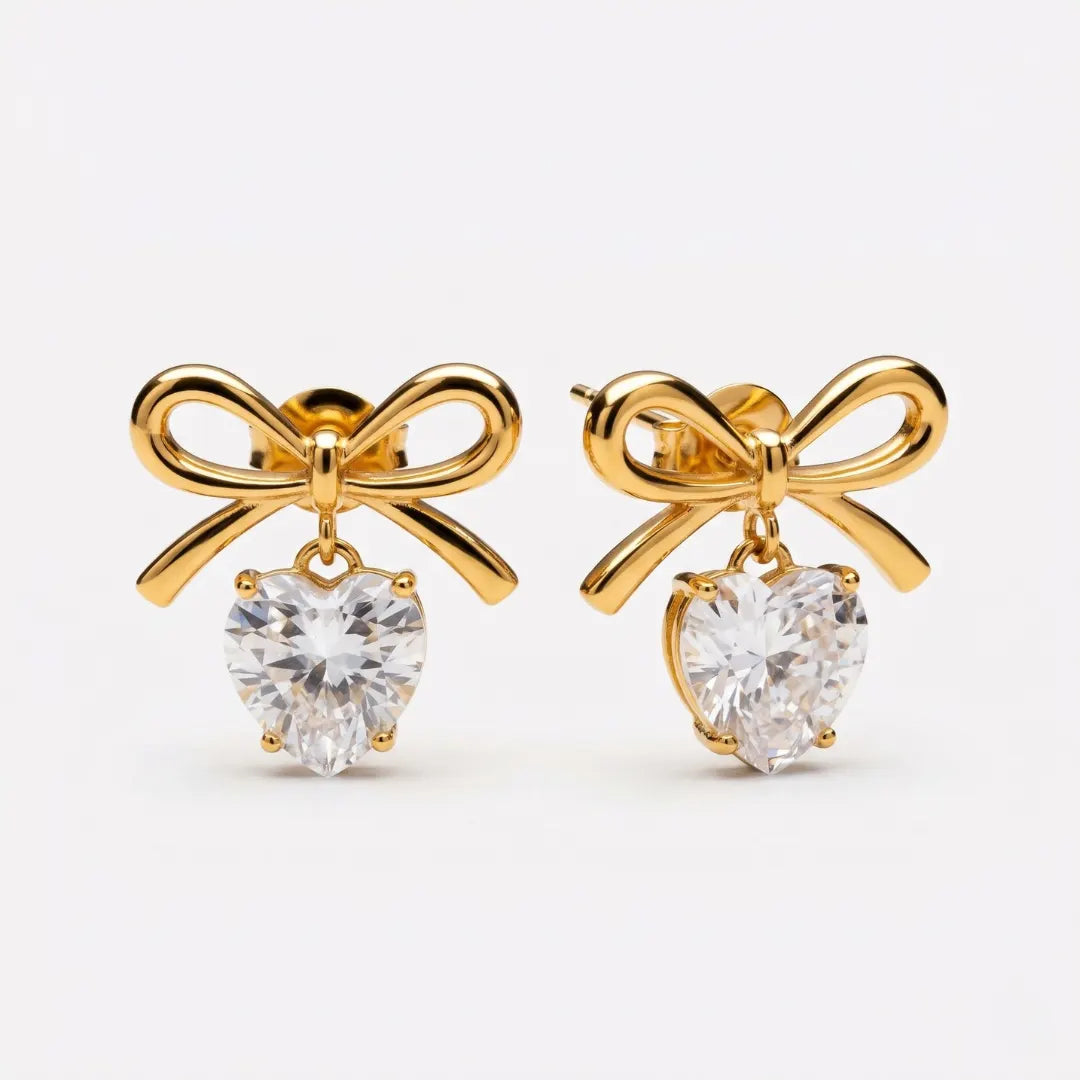 Celeste Bow Heart Earrings – waterproof bow earrings for women, gold bow studs with heart-cut zircon drops, anti-tarnish 18K gold PVD | Priskel Jewellery