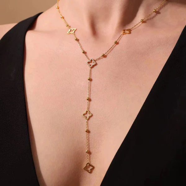 Clover Lariat Necklace worn with a black V-neck, close-up on the drop – sweatproof, hypoallergenic lariat necklace