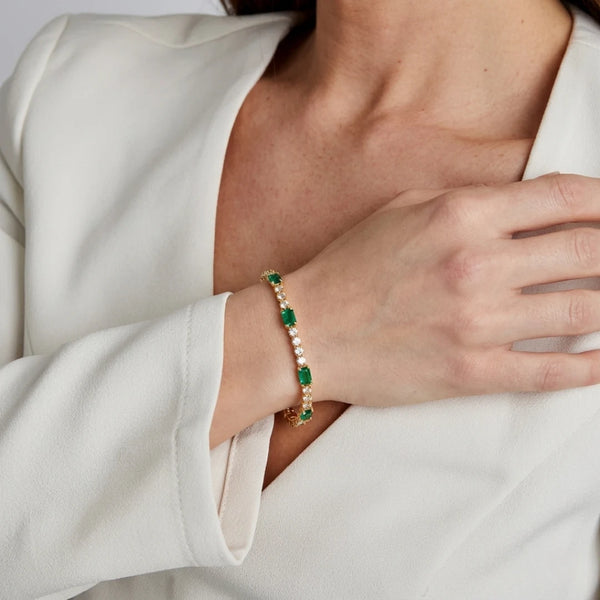 Emerald Baguette Tennis Bracelet worn on the wrist with a white shirt – anti-tarnish tennis bracelet for daily wear