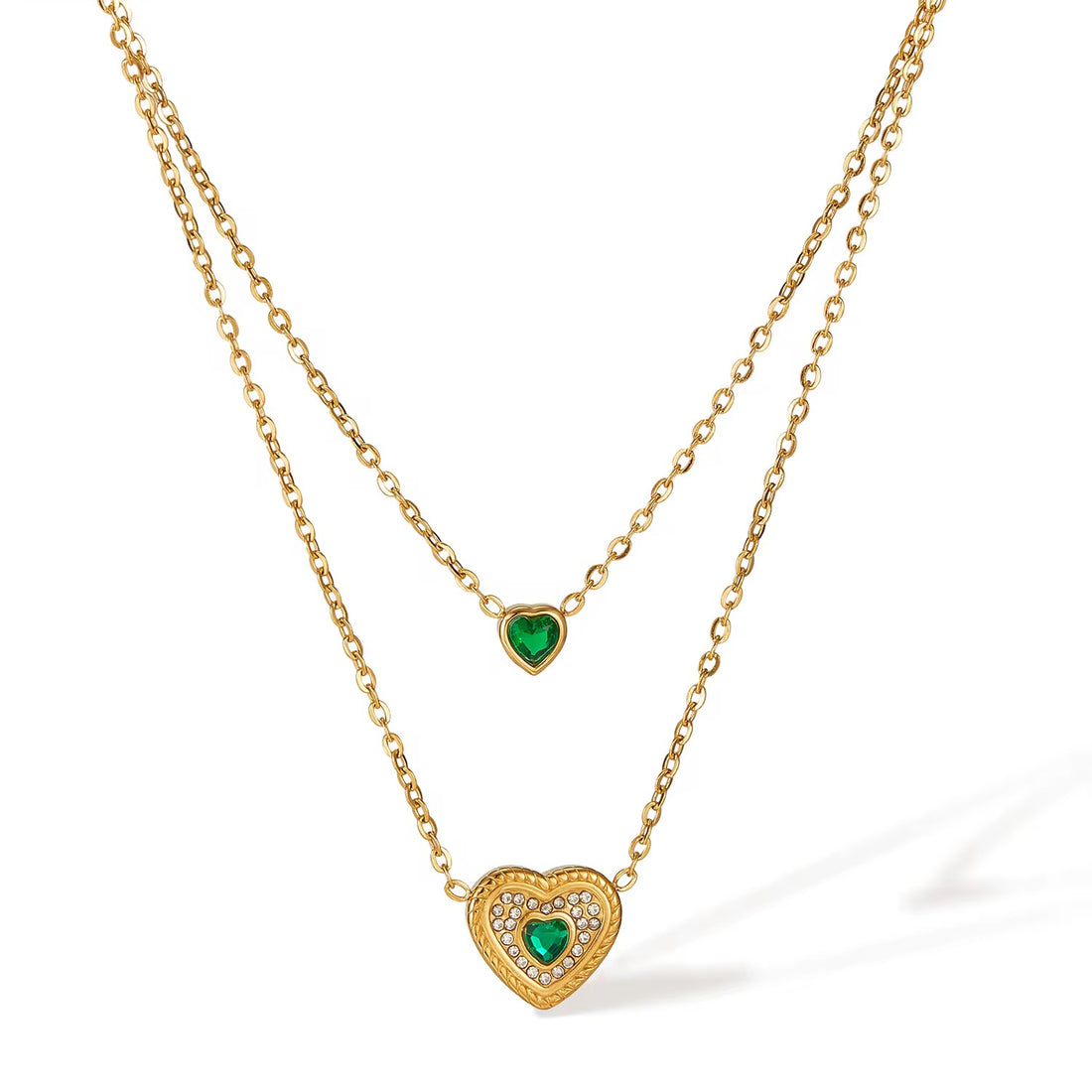 Emerald Heart Layered Necklace laid out on white with emerald heart pendants – anti-tarnish layered necklace for daily wear