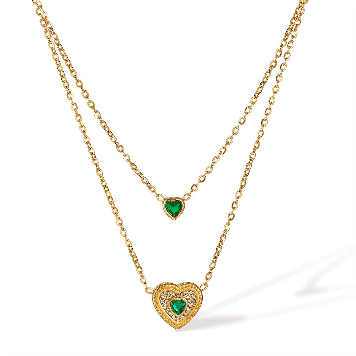 Emerald Heart Layered Necklace laid out on white with emerald heart pendants – anti-tarnish layered necklace for daily wear