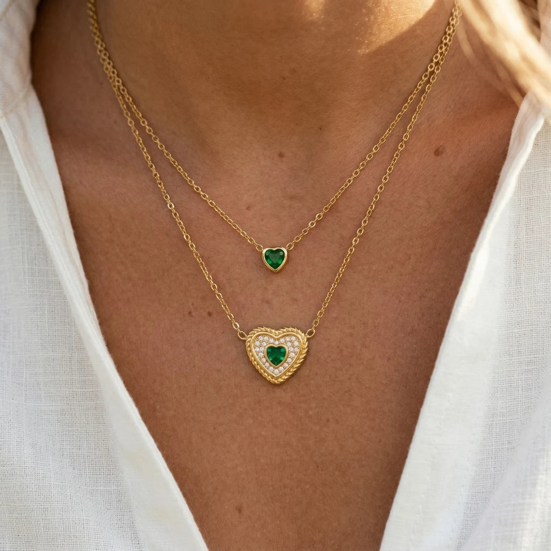 Emerald Heart Layered Necklace worn with a white top, close-up on both layers