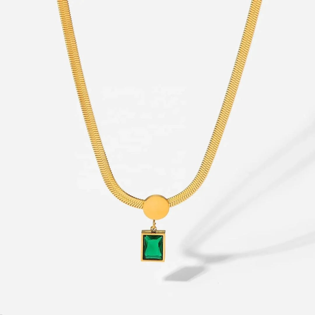 Emerald Pendant Necklace on a snake chain laid out on white – anti-tarnish pendant necklace for daily wear