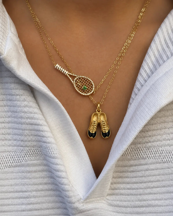 Football Cleats Charm worn on a gold chain with a white shirt, close-up – sweatproof, hypoallergenic charm
