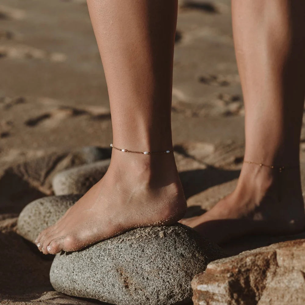 Freshwater Pearls Anklet worn on the ankle resting on a rock – anti-tarnish anklet for daily wear