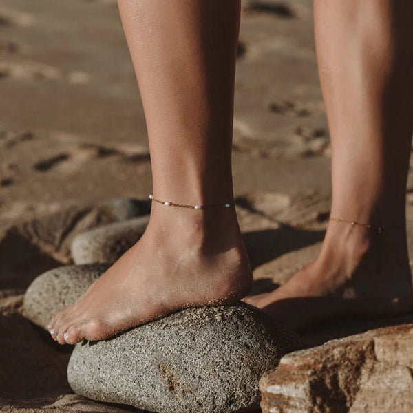 Freshwater Pearls Anklet worn on the ankle resting on a rock – anti-tarnish anklet for daily wear