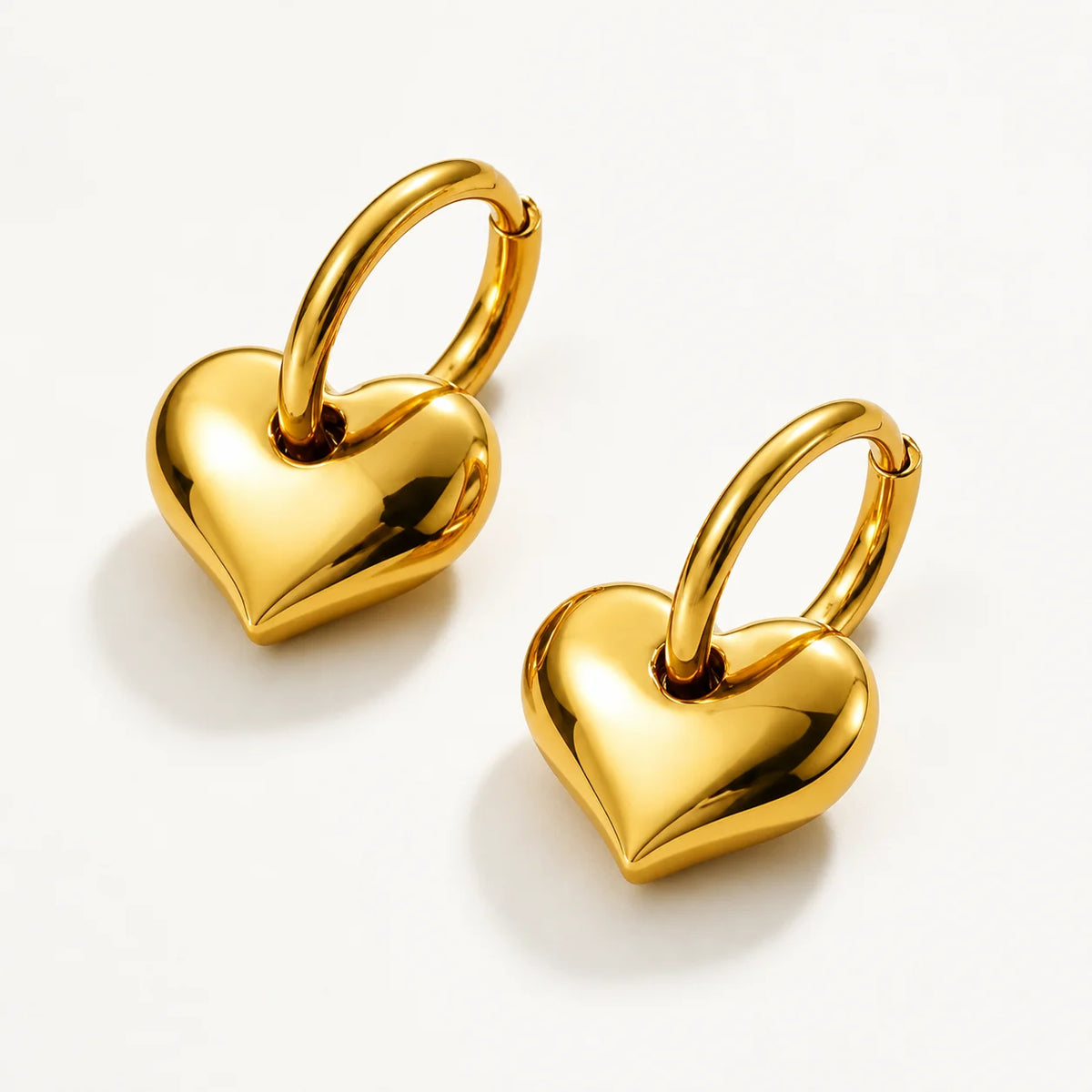 Gold Heart Hoop Earrings – waterproof hoop earrings for women, polished puffed heart charms on 14 mm hoops, anti-tarnish 18K gold PVD | Priskel Jewellery