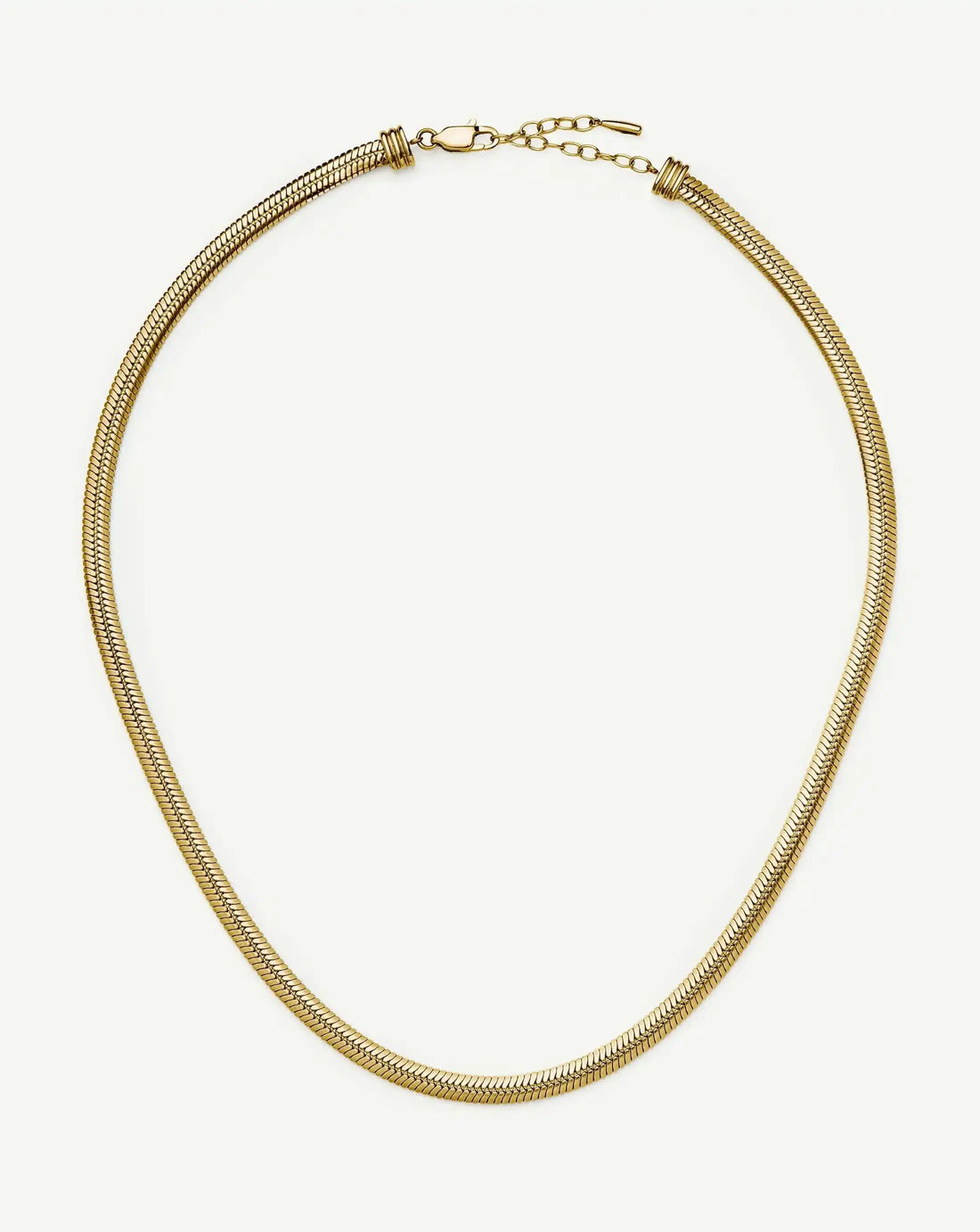 Golden Herringbone Necklace – chain laid in a circle on white, waterproof gold herringbone necklace
