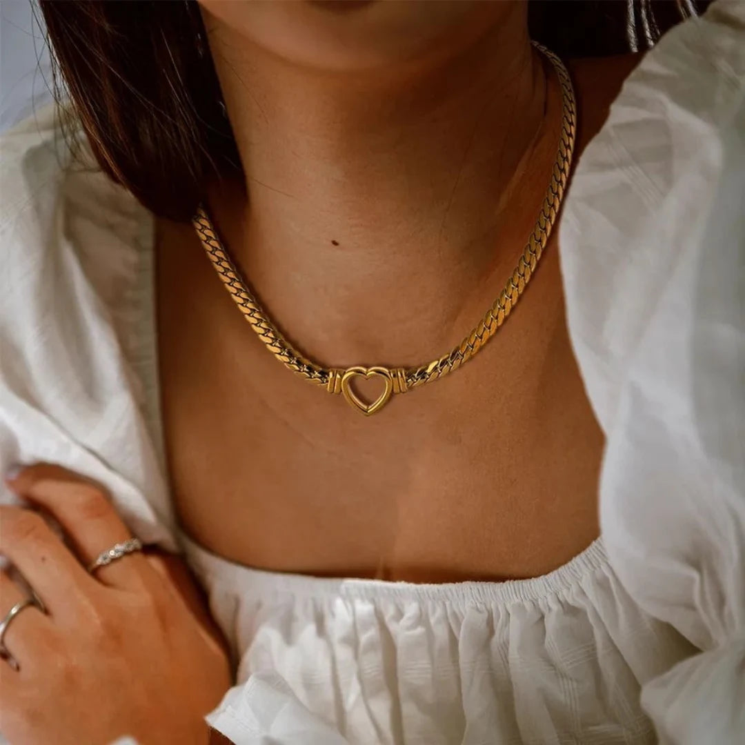 Heart Chain Necklace worn by a model in a white blouse