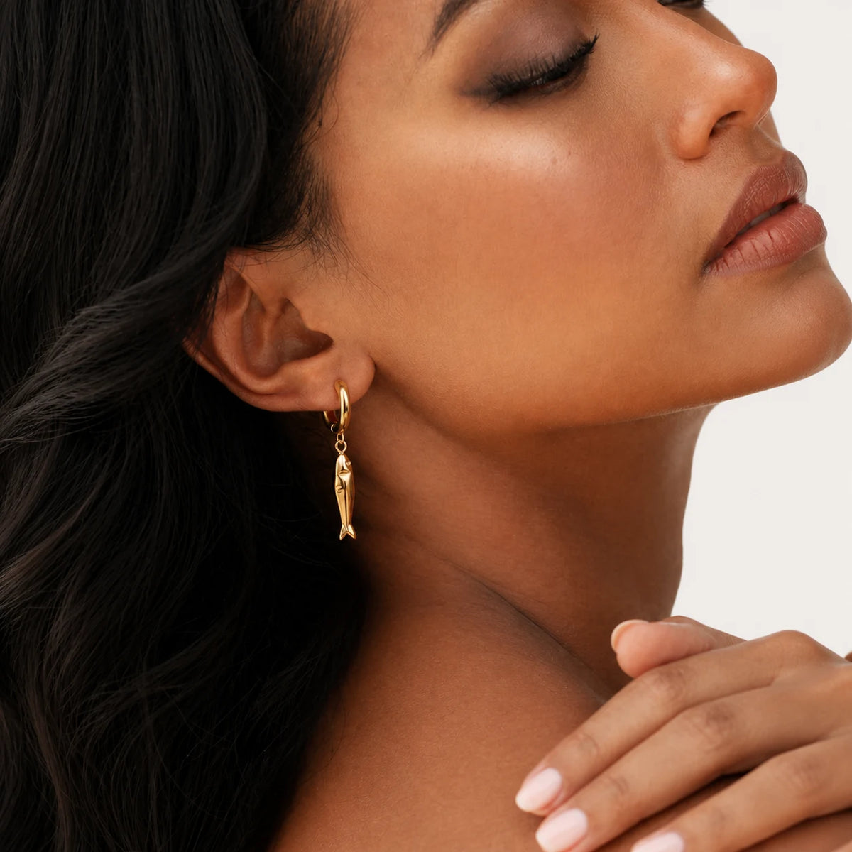 Matsya Hoops worn by a model in profile, waterproof gold hoop earrings