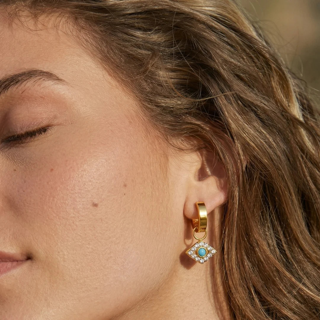 Nazar Charm Hoops worn by a model with eyes closed