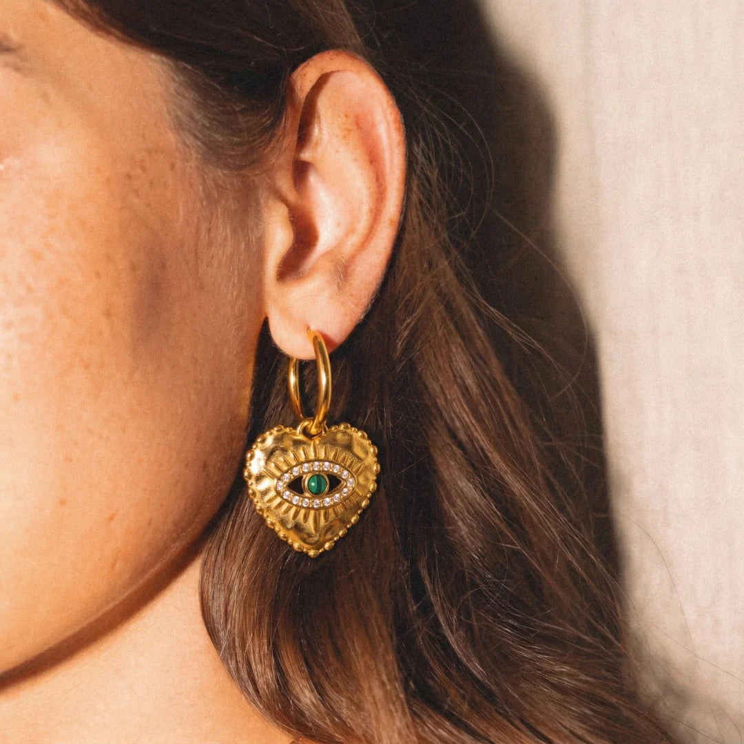 Nazar Heart Hoops worn on the ear, close-up, waterproof gold evil eye earrings