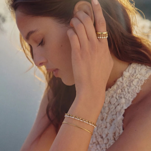 Starlight Dangle Ring worn by a model touching her hair – anti-tarnish ring for daily wear