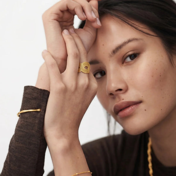 Tidal Wave Ring worn by a model in a brown top, hands framing the face – sweatproof, hypoallergenic open ring