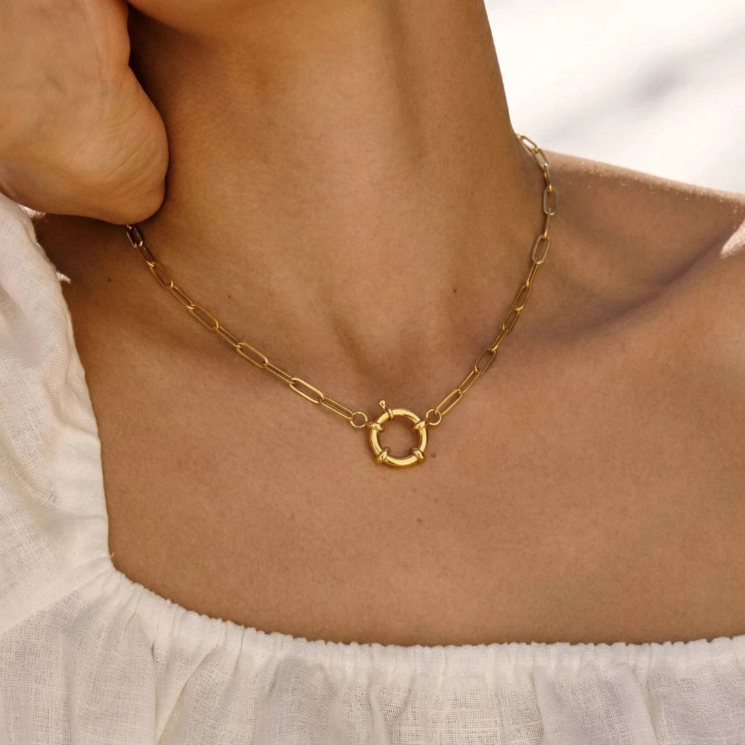 Toggle Link Necklace worn on the neckline, close-up on the toggle clasp, waterproof gold link necklace