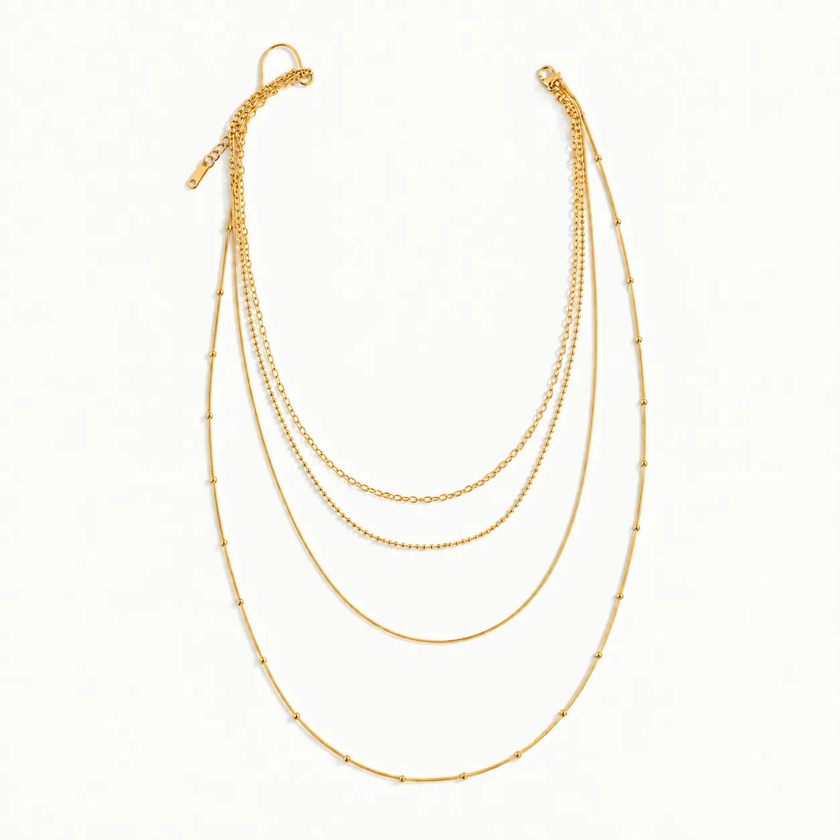 Trio Chain Layered Necklace – snake, cable and ball chains laid out on white at three lengths, waterproof gold layered necklace