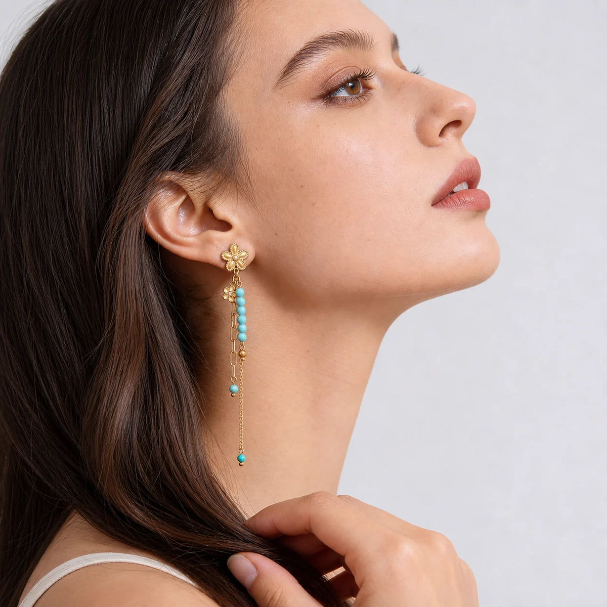 Turquoise Bloom Drop Earrings worn by a model in profile, waterproof gold drop earrings